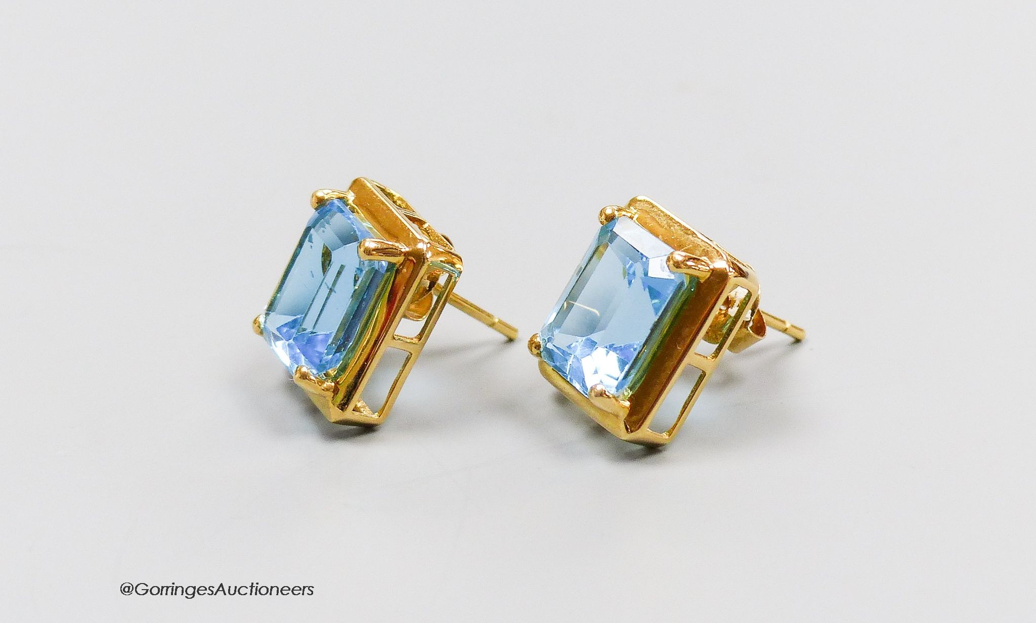 A pair of 18ct gold and topaz earrings, gross 4g.